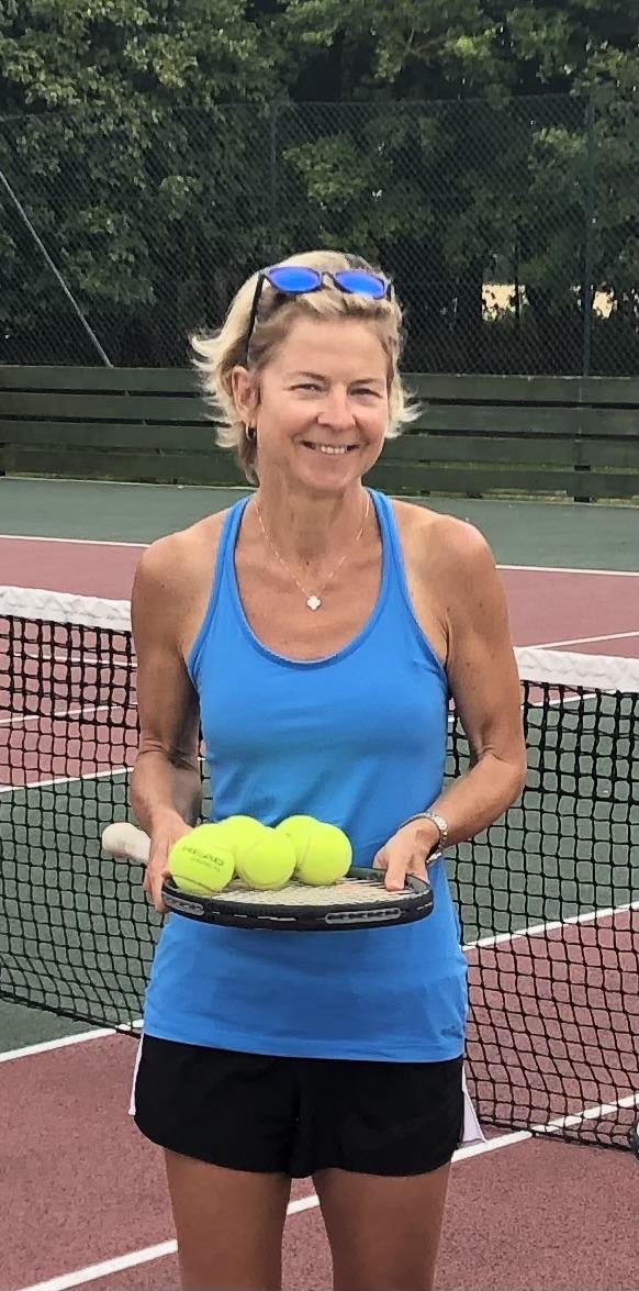 Olga Blecher, tennis coach, on court at Pirton Tennis Club